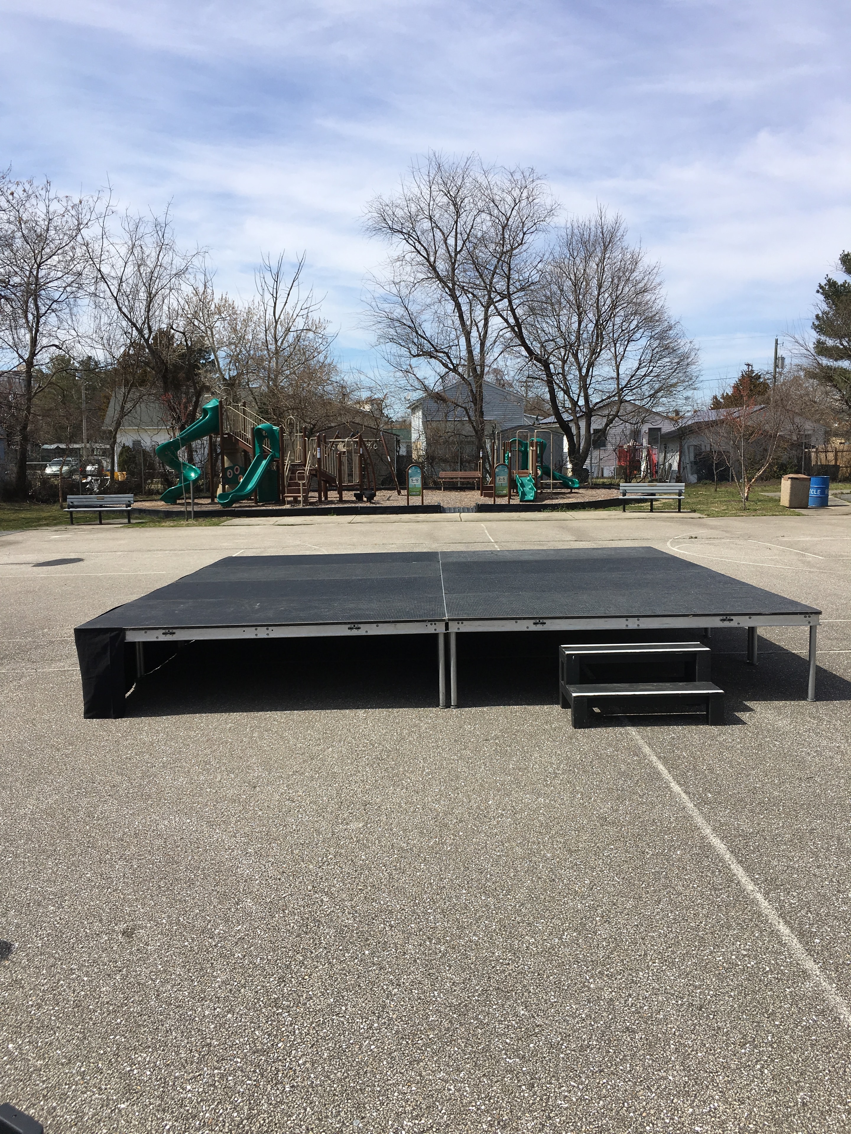 Black stage platform with speaker wings