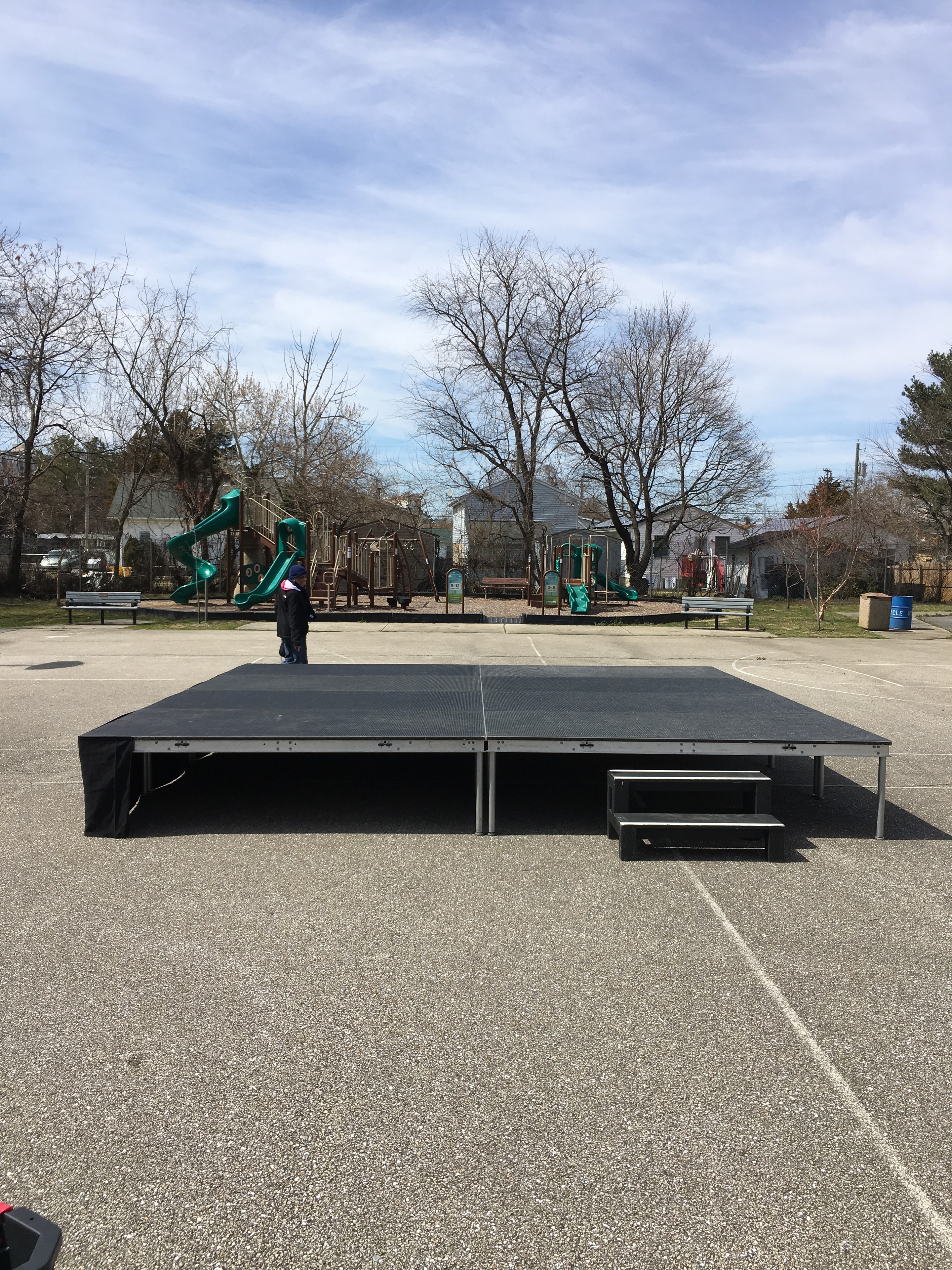 Large black stage with dual speaker towers