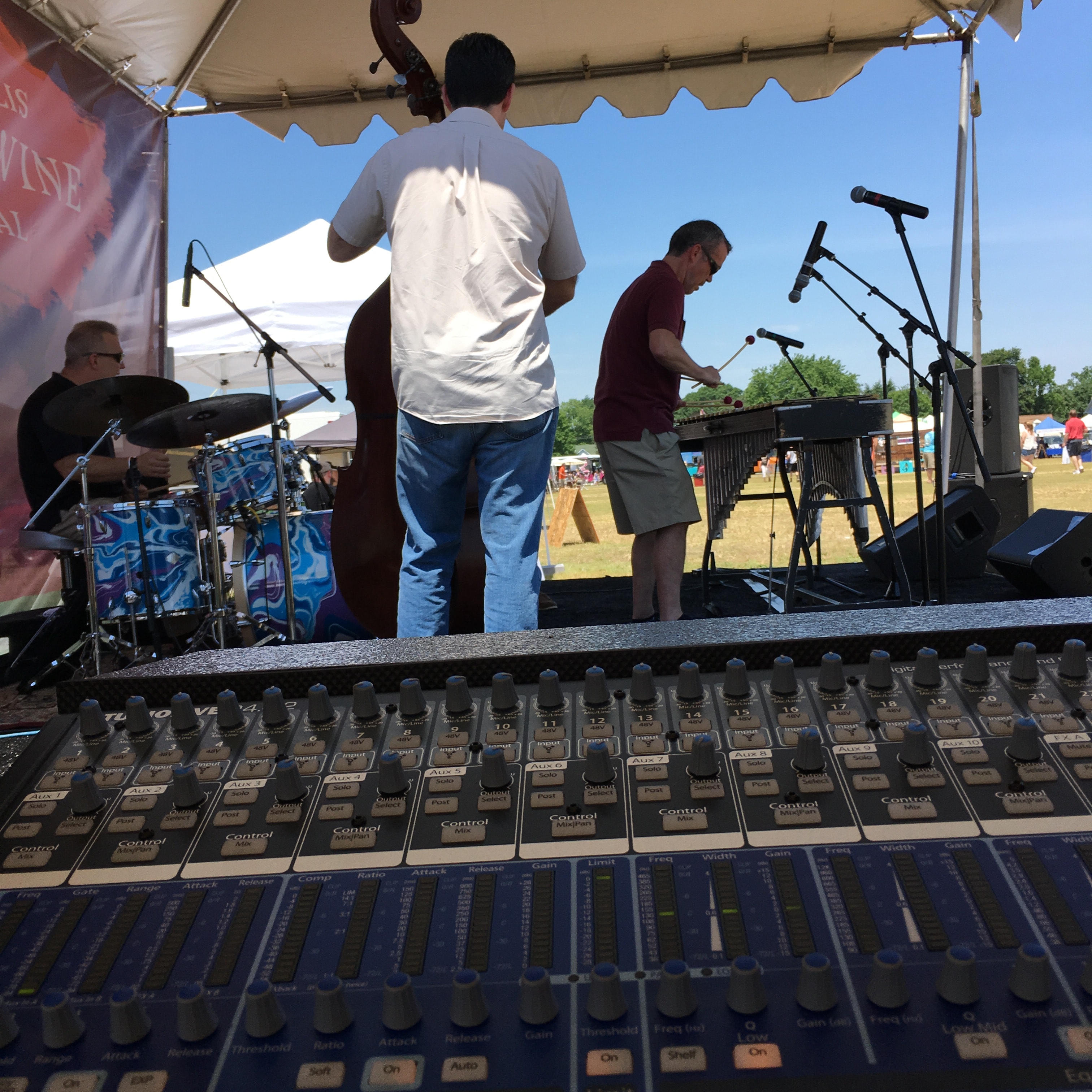 Live band performing at outdoor festival stage