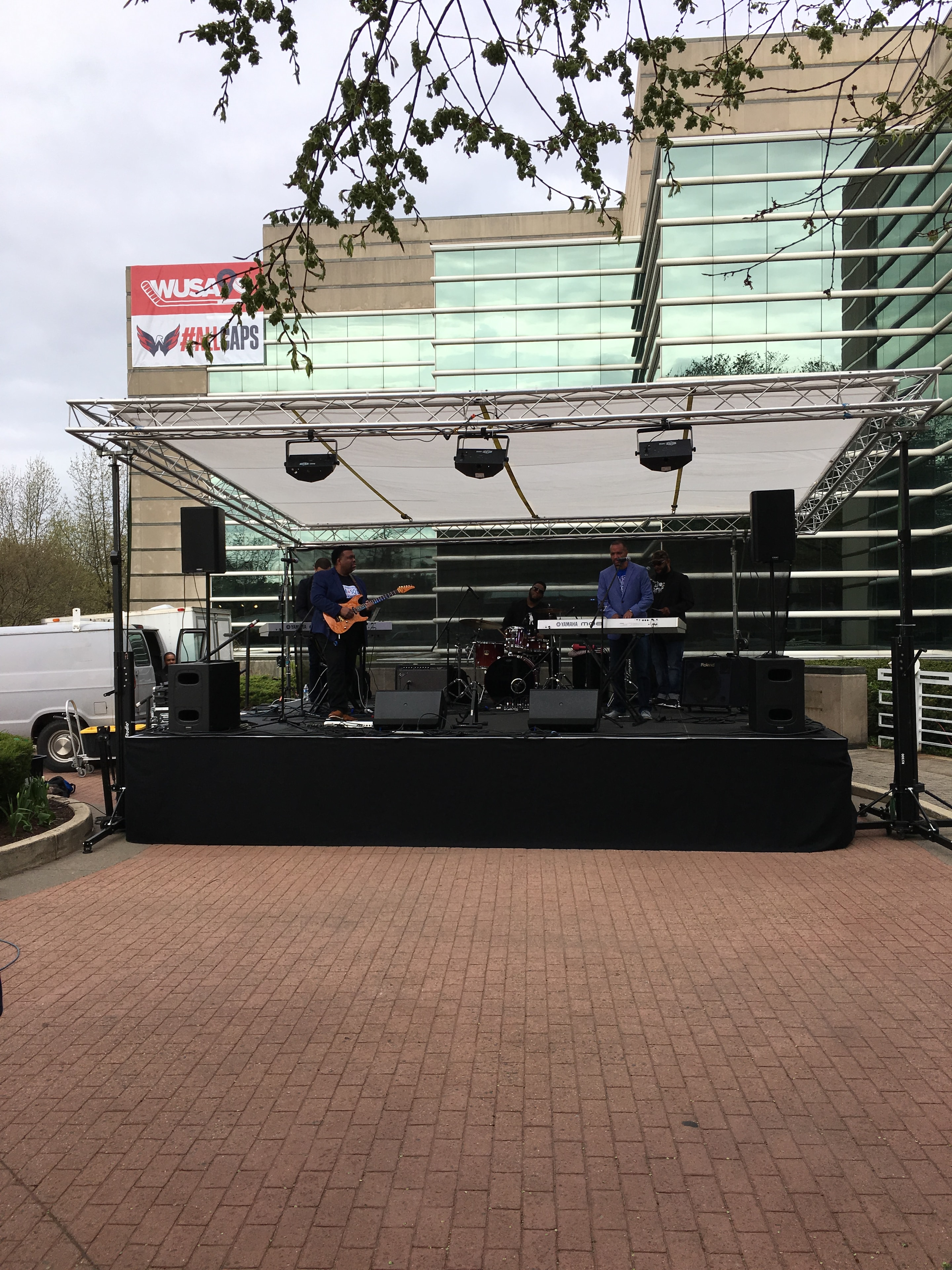Outdoor stage setup at WUSA Caps event