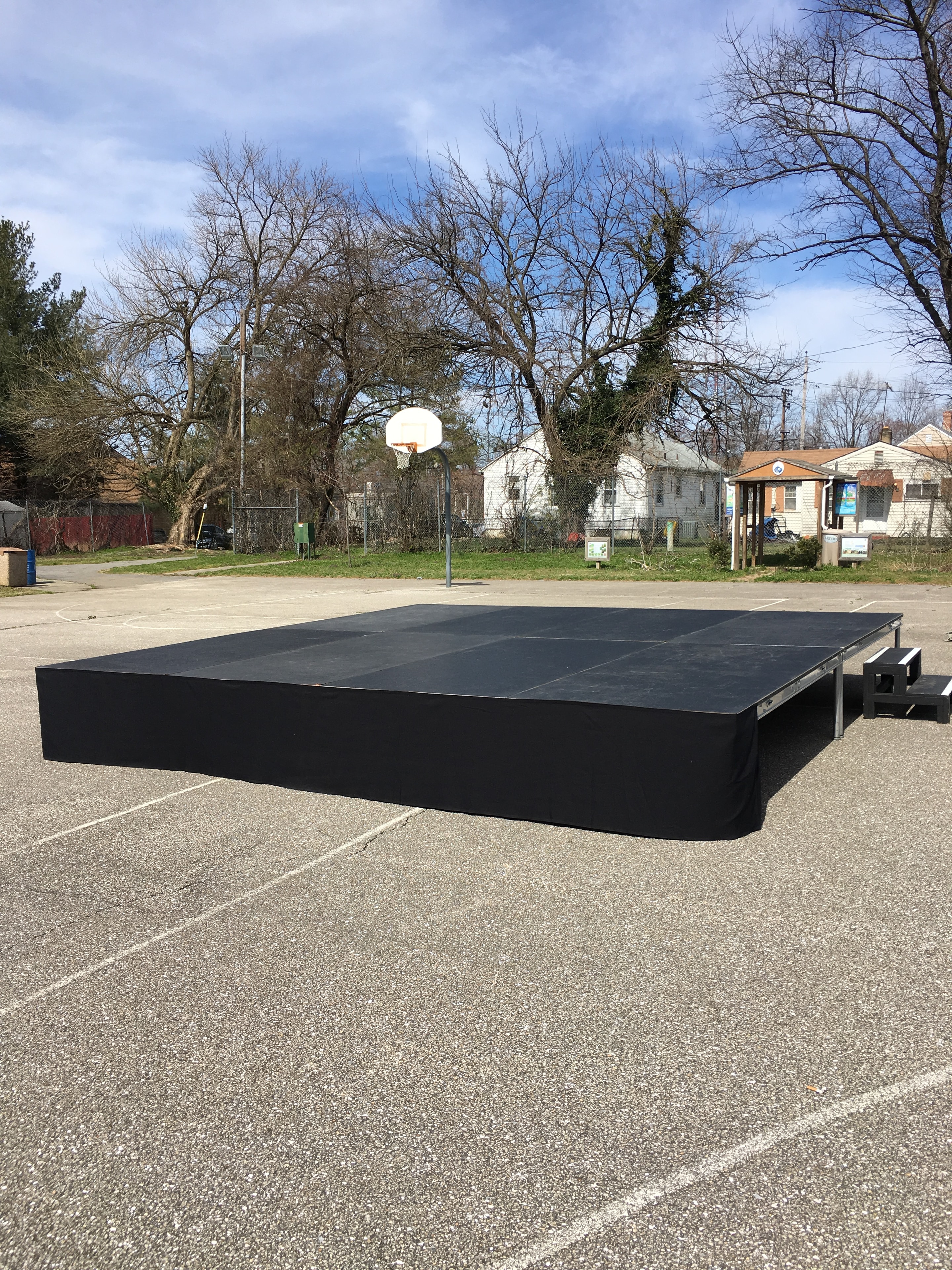 Portable black stage platform outdoors