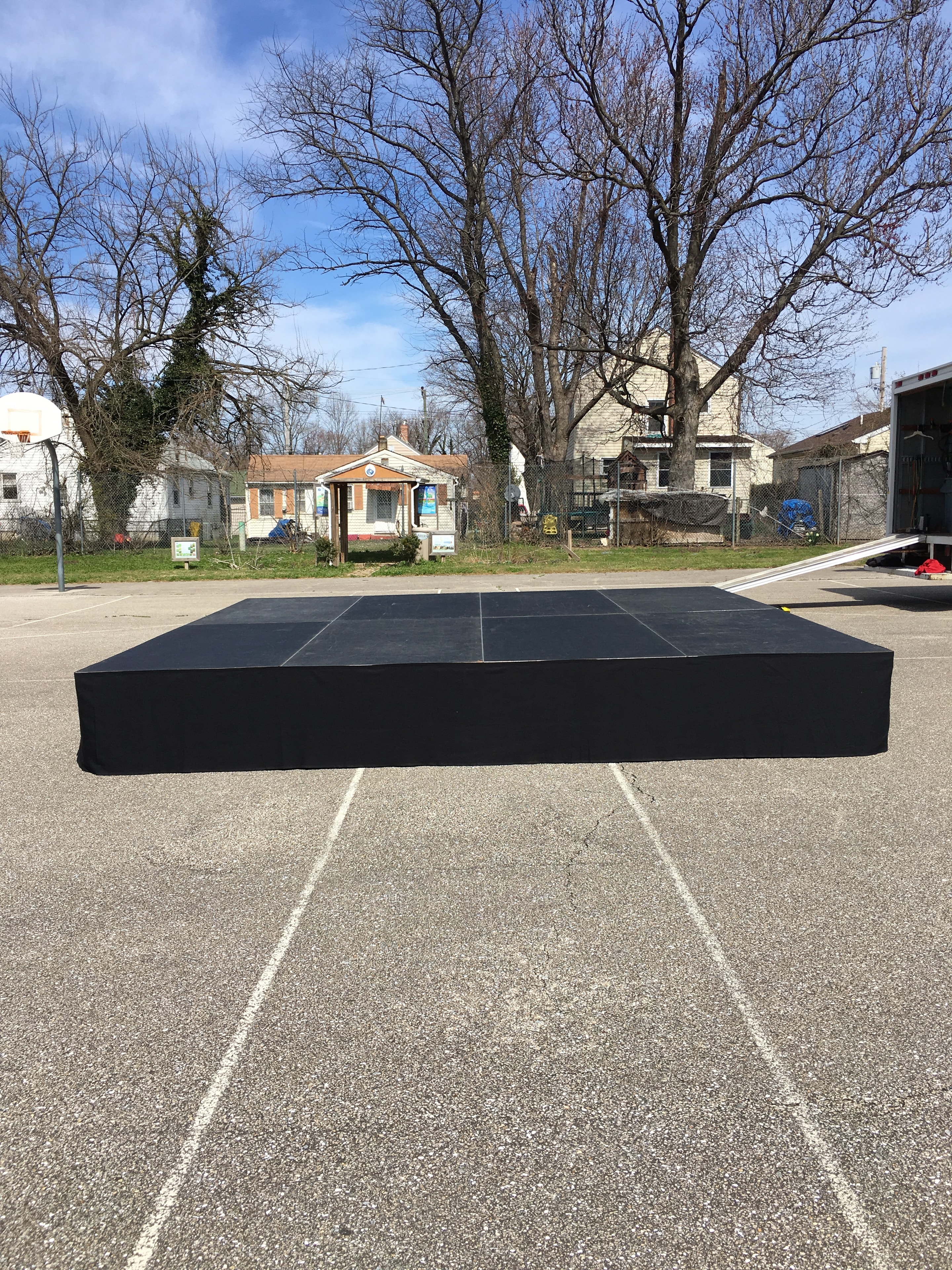 Portable black stage platform outdoors