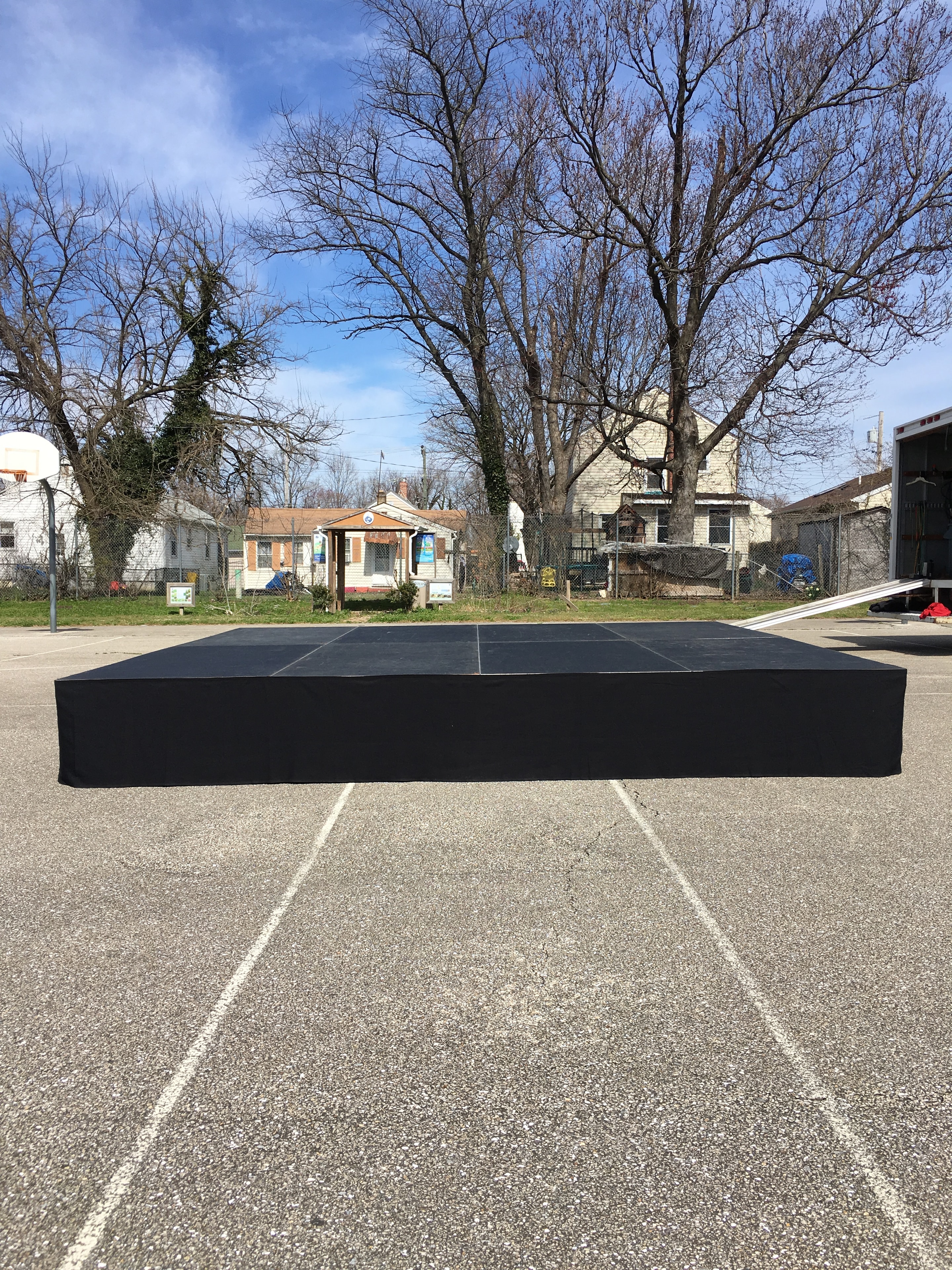 Portable black stage platform outdoors