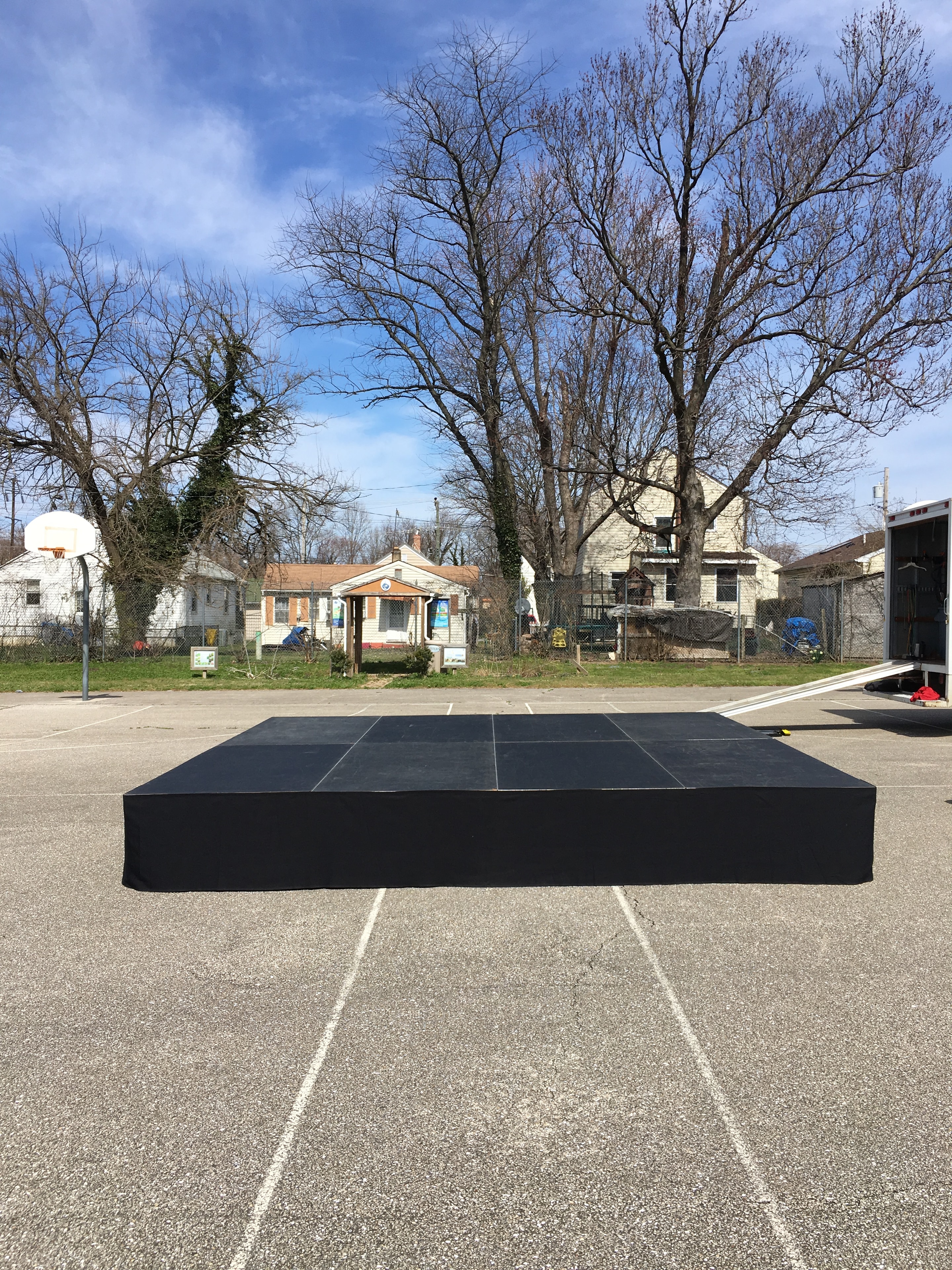 Black stage platform with speaker wings